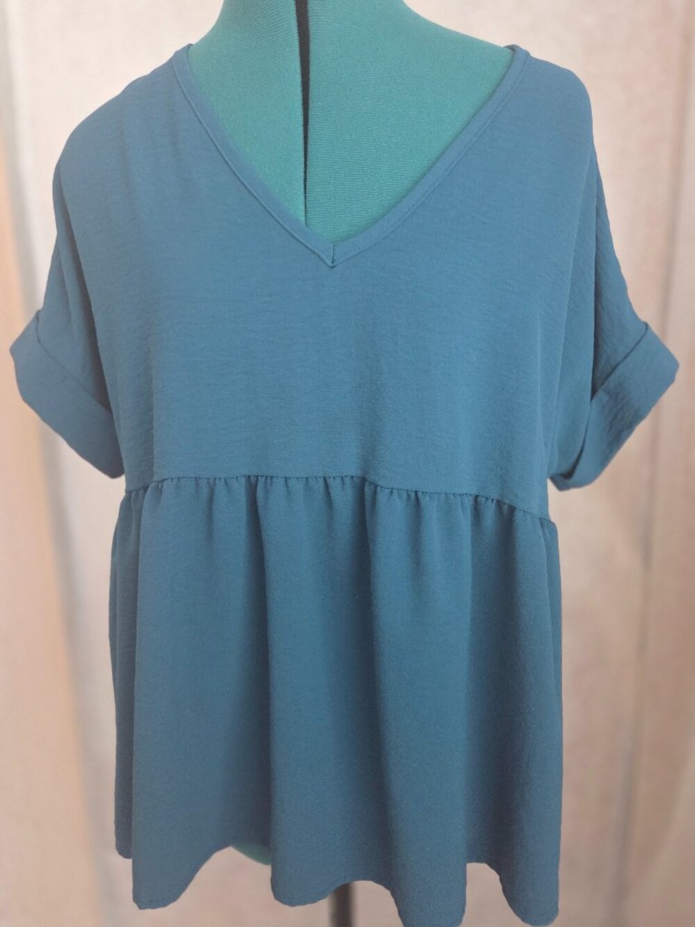 Short sleeve Baby doll top.